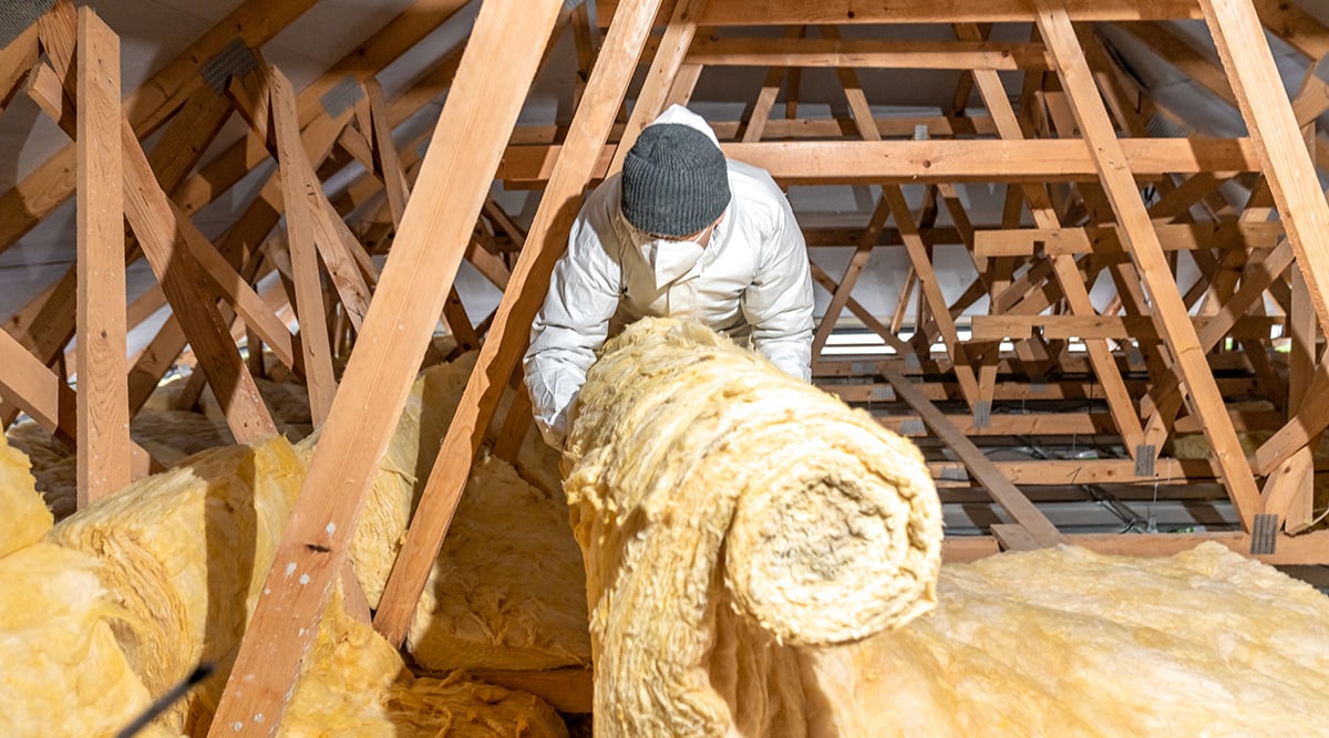 man insulating loft