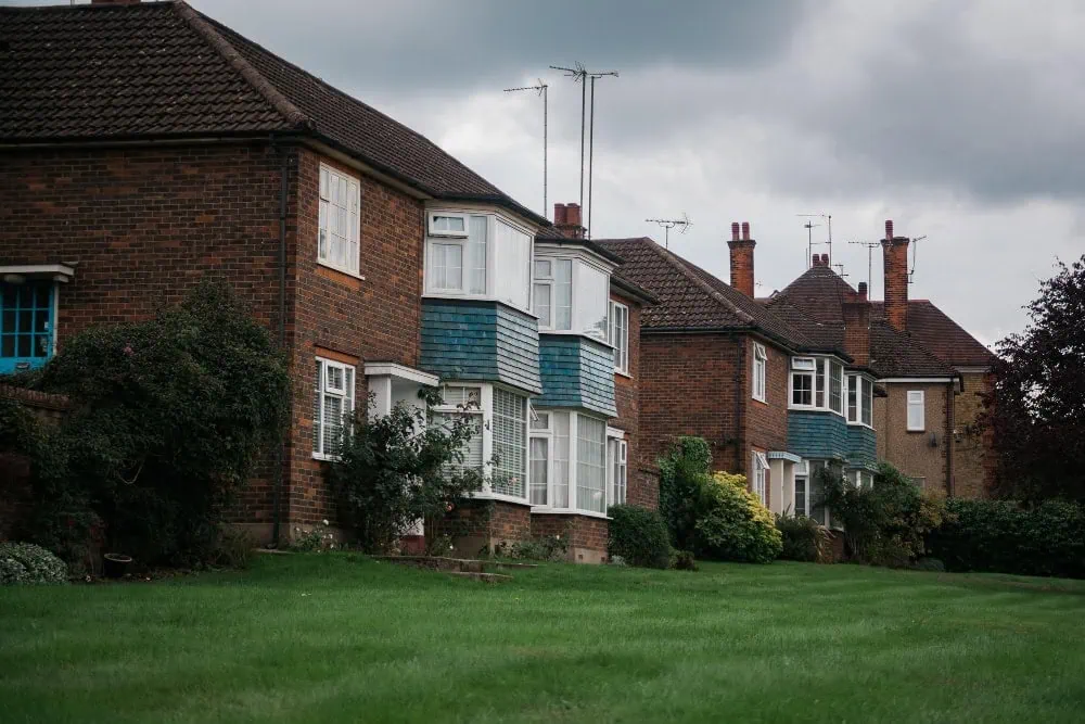 Row of houses with green lawn