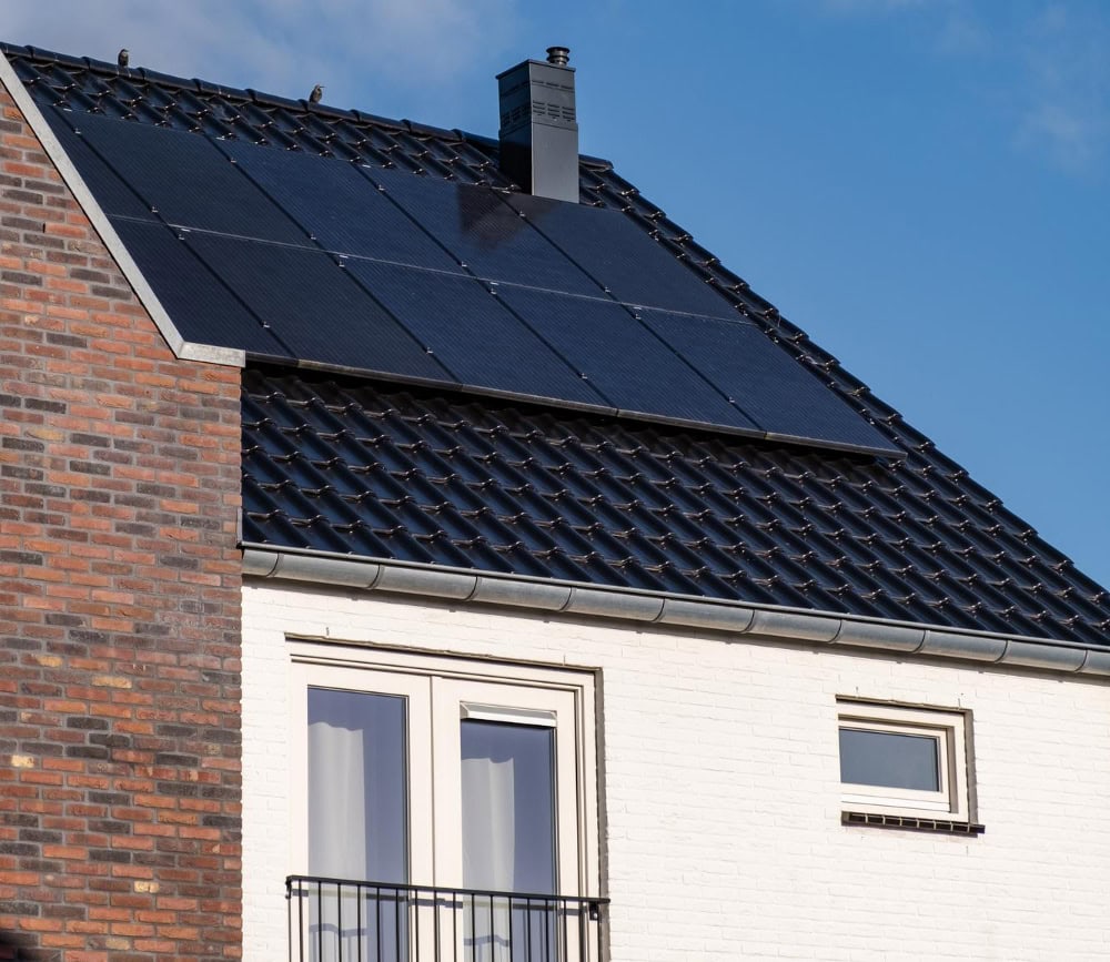 House roof with solar panels and chimney.